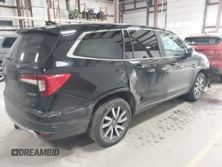 2019 Honda Pilot EX-L with VIN 5FNYF6H5XKB067858, listed as a IAAI auction lot 41643807 with 102,114 mi miles and . Bid and sale history available at carsss.com. Image 4.