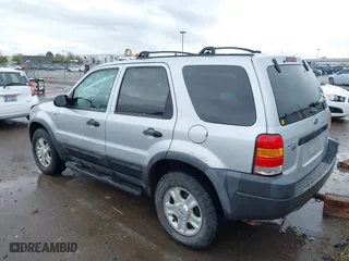2002 Ford Escape Limited with VIN 1FMCU04152KA38640, listed as a IAAI auction lot 41895674 with 106,449 mi miles. Bid and sale history available at carsss.com. Image 3.