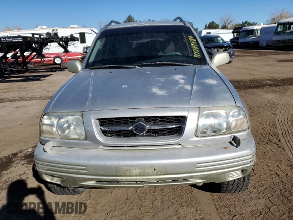 1999 Suzuki Grand Vitara JLX z VIN JS3TD62V0X4113058, wystawiony jako Copart lot #80089884 z przebiegiem 165 794 mil mil oraz Szkoda całkowita • Salvage title. Historia ofert i sprzedaży dostępna na DreamBid. Obrazek 5.