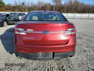 2014 Ford Taurus Limited with VIN 1FAHP2F81EG183128, listed as a Copart auction lot 82409384 with 107,624 mi miles and Salvage title. Bid and sale history available at DreamBid. Image 6.