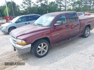 2001 Dodge Dakota Sport with VIN 1B7HL2AN91S278613, listed as a IAAI auction lot 42047239 with 178,321 mi miles and . Bid and sale history available at carsss.com. Image 2.