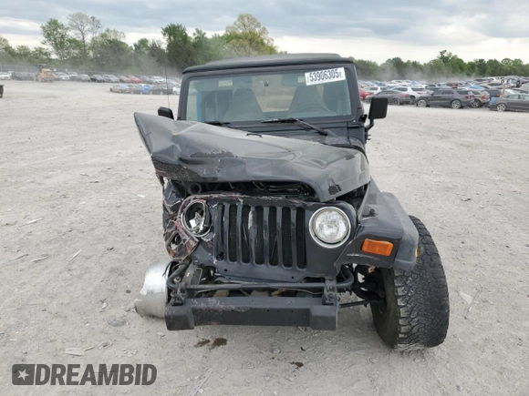 2000 Jeep Wrangler Sport with VIN 1J4FA49S9YP743515, listed as a Copart auction lot 53906305 with 247,349 mi miles and Salvage title. Bid and sale history available at DreamBid. Image 5.