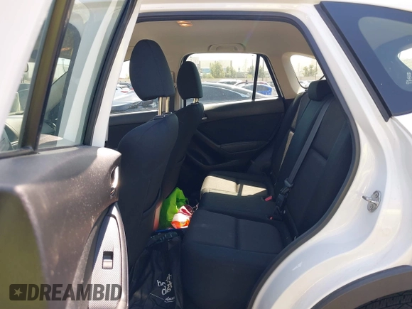 2016 Mazda CX-5 Sport with VIN JM3KE2BY9G0825285, listed as a IAAI auction lot 41841833 with 96,915 mi miles. Bid and sale history available at carsss.com. Image 8.