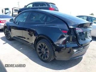 2024 Tesla Model Y with VIN 7SAYGDED9RF191453, listed as a IAAI auction lot 42272051 with 7,805 mi miles and . Bid and sale history available at DreamBid. Image 3.