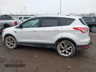 2016 Ford Escape Titanium with VIN 1FMCU9J94GUC22994, listed as a IAAI auction lot 42010816 with 80,293 mi miles. Bid and sale history available at carsss.com. Image 14.