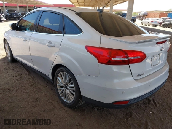 2015 Ford Focus Titanium with VIN 1FADP3J28FL256155, listed as a IAAI auction lot 42350610 with 53,840 mi miles and . Bid and sale history available at DreamBid. Image 3.