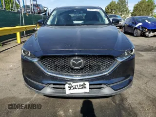 2021 Mazda CX-5 Grand Touring with VIN JM3KFBDM3M1344784, listed as a Copart auction lot 58051445 with 69,593 mi miles and Salvage title. Bid and sale history available at DreamBid. Image 5.