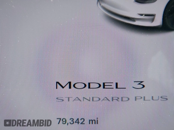 2020 Tesla Model 3 Standard Range Plus with VIN 5YJ3E1EAXLF590591, listed as a IAAI auction lot 42140338 with 79,342 mi miles and . Bid and sale history available at DreamBid. Image 16.