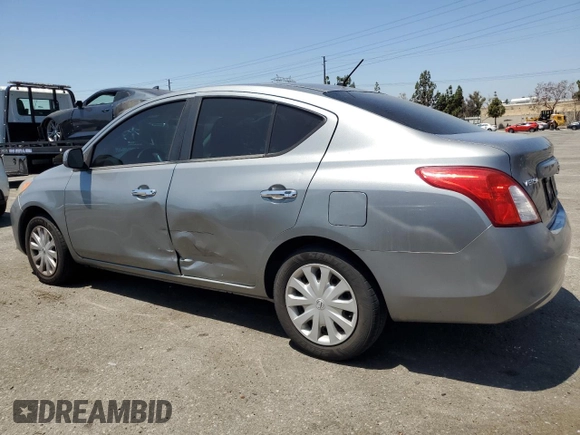 2012 Nissan Versa SV with VIN 3N1CN7AP8CL818508, listed as a Copart auction lot 63164515 with 94,455 mi miles and Salvage title. Bid and sale history available at DreamBid. Image 2.