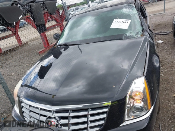 2008 Cadillac DTS 1SA z VIN 1G6KD57Y98U102801, wystawiony jako IAAI lot #42204185 z przebiegiem 152 990 mil mil oraz . Historia ofert i sprzedaży dostępna na DreamBid. Obrazek 14.