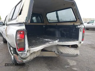 2004 Nissan Frontier XE with VIN 1N6DD26T54C403203, listed as a IAAI auction lot 41658314 with 203,648 mi miles and . Bid and sale history available at DreamBid. Image 6.