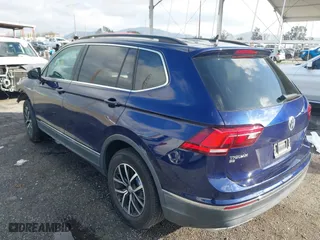 2021 Volkswagen Tiguan SE with VIN 3VV3B7AX9MM051125, listed as a IAAI auction lot 41527014 with 68,847 mi miles. Bid and sale history available at carsss.com. Image 3.