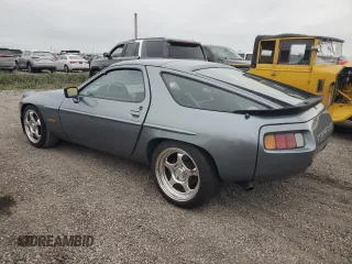 1983 Porsche 928 z VIN WP0ZZZ92ZDS841622, wystawiony jako Copart lot #76995304 z przebiegiem 83 862 mil mil oraz Szkody całkowita. Historia ofert i sprzedaży dostępna na DreamBid. Obrazek 2.