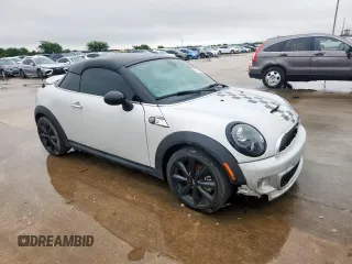 2015 MINI Coupe S z VIN WMWSX3C51FT409464, wystawiony jako Copart lot #60761415 z przebiegiem Nie podano mil oraz Czysty tytuł • Clean title. Historia ofert i sprzedaży dostępna na DreamBid. Obrazek 4.