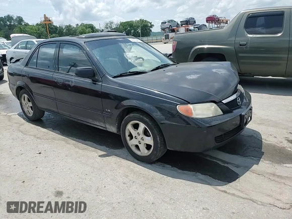 2002 Mazda Protege DX z VIN JM1BJ225020537013, wystawiony jako Copart lot #56952495 z przebiegiem 129 846 mil mil oraz Czysty tytuł • Clean title. Historia ofert i sprzedaży dostępna na DreamBid. Obrazek 13.