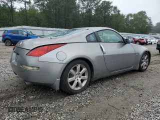 2003 Nissan 350Z Performance z VIN JN1AZ34D33T106988, wystawiony jako Copart lot #57933985 z przebiegiem 203 959 mil mil oraz Szkoda całkowita • Salvage title. Historia ofert i sprzedaży dostępna na DreamBid. Obrazek 3.