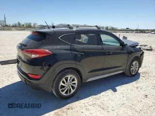 2017 Hyundai Tucson SE with VIN KM8J33A40HU409713, listed as a Copart auction lot 50105805 with 100,463 mi miles and Salvage Title. Bid and sale history available at DreamBid. Image 3.