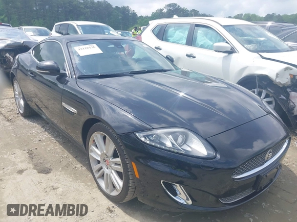 2012 Jaguar XK with VIN SAJWA4FB8CLB47049, listed as a IAAI auction lot 42118136 with 60,953 mi miles. Bid and sale history available at carsss.com. Image 1.