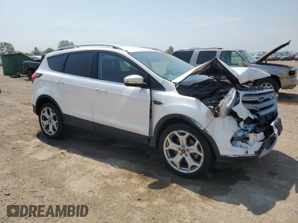 2019 Ford Escape Titanium z VIN 1FMCU9J93KUA51020, wystawiony jako Copart lot #60462495 z przebiegiem 59 998 mil mil oraz Szkoda całkowita • Salvage title. Historia ofert i sprzedaży dostępna na DreamBid. Obrazek 4.