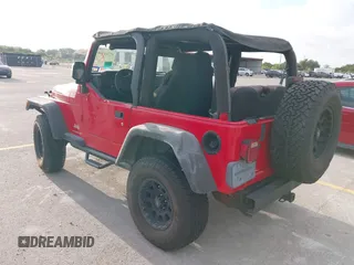 2003 Jeep Wrangler SE z VIN 1J4FA29113P323655, wystawiony jako IAAI lot #42704498 z przebiegiem 189 763 mil mil oraz . Historia ofert i sprzedaży dostępna na DreamBid. Obrazek 3.