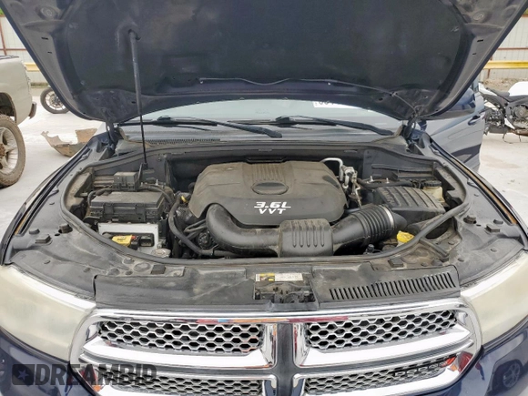 2013 Dodge Durango SXT z VIN 1C4RDHAG4DC685467, wystawiony jako Copart lot #60140355 z przebiegiem 173 752 mil mil oraz Czysty tytuł • Clean title. Historia ofert i sprzedaży dostępna na DreamBid. Obrazek 12.