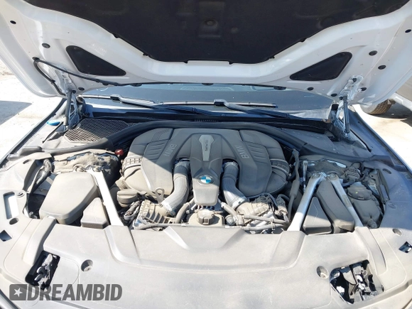 2019 BMW 7 Series 750i with VIN WBA7F0C5XKGM25771, listed as a IAAI auction lot 42167614 with 73,692 mi miles. Bid and sale history available at carsss.com. Image 10.