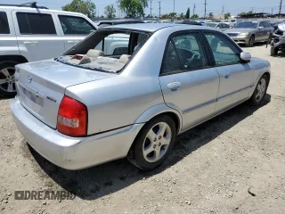 2002 Mazda Protege DX z VIN JM1BJ225920543960, wystawiony jako Copart lot #56336555 z przebiegiem 173 874 mil mil oraz Szkoda całkowita • Salvage title. Historia ofert i sprzedaży dostępna na DreamBid. Obrazek 3.