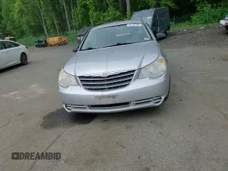 2010 Chrysler Sebring Touring z VIN 1C3CC4FB3AN203543, wystawiony jako Copart lot #57767985 z przebiegiem 152 951 mil mil oraz Szkoda całkowita • Salvage title. Historia ofert i sprzedaży dostępna na DreamBid. Obrazek 13.
