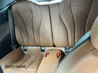 2023 BMW M8 Competition with VIN WBSDZ0C07PCK30073, listed as a Copart auction lot 49407825 with 999,999 mi miles and Salvage Title. Bid and sale history available at carsss.com. Image 9.