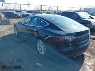 2013 Tesla Model S with VIN 5YJSA1CN7DFP26335, listed as a IAAI auction lot 41529752 with 247,789 mi miles. Bid and sale history available at carsss.com. Image 3.