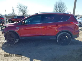 2016 Ford Escape Titanium with VIN 1FMCU9J98GUB42453, listed as a IAAI auction lot 41760110 with 116,452 mi miles. Bid and sale history available at carsss.com. Image 15.