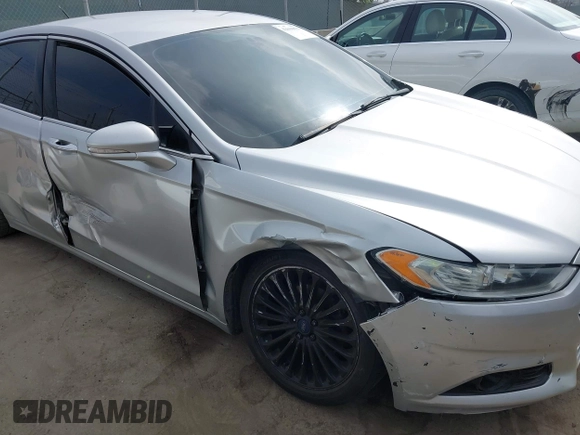 2016 Ford Fusion Titanium z VIN 3FA6P0K92GR135076, wystawiony jako IAAI lot #42604875 z przebiegiem 192 785 mil mil oraz . Historia ofert i sprzedaży dostępna na DreamBid. Obrazek 6.
