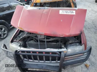 2002 Jeep Grand Cherokee z VIN 1J8GW38S72C159886, wystawiony jako Copart lot #77765704 z przebiegiem Nie podano mil oraz Szkoda całkowita • Salvage title. Historia ofert i sprzedaży dostępna na DreamBid. Obrazek 12.