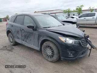2016 Mazda CX-5 Touring z VIN JM3KE4CY5G0884683, wystawiony jako IAAI lot #42358437 z przebiegiem 134 464 mil mil oraz . Historia ofert i sprzedaży dostępna na DreamBid. Obrazek 1.