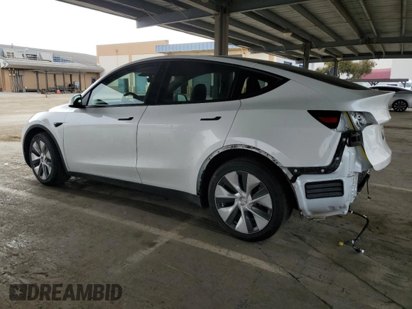 2022 Tesla Model Y Long Range z VIN 7SAYGAEE9NF493262, wystawiony jako Copart lot #52975005 z przebiegiem 63 189 mil mil oraz Szkoda całkowita • Salvage title. Historia ofert i sprzedaży dostępna na DreamBid. Obrazek 2.