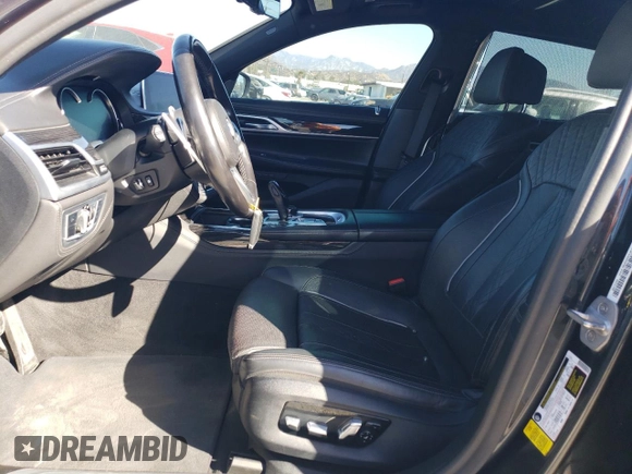 2019 BMW 7 Series 750i with VIN WBA7F0C56KGM25430, listed as a Copart auction lot 42048135 with 74,717 mi miles and Salvage title. Bid and sale history available at DreamBid. Image 7.