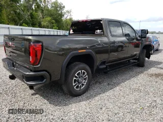 2023 GMC Sierra 3500HD AT4 z VIN 1GT49VEY3PF127108, wystawiony jako Copart lot #57052823 z przebiegiem 9915 mil mil oraz Szkody całkowita. Historia ofert i sprzedaży dostępna na DreamBid. Obrazek 3.