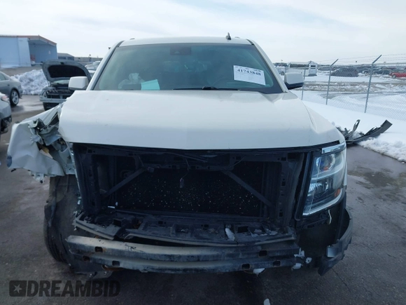 2015 Chevrolet Suburban LT with VIN 1GNSKJKC0FR309866, listed as a IAAI auction lot 41743848 with 220,778 mi miles and . Bid and sale history available at DreamBid. Image 12.