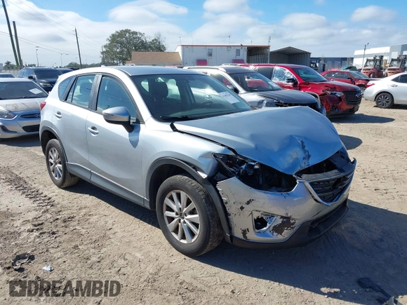 2016 Mazda CX-5 Sport with VIN JM3KE2BE9G0915168, listed as a IAAI auction lot 41482749 with 86,802 mi miles and . Bid and sale history available at carsss.com. Image 1.
