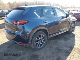 2017 Mazda CX-5 Grand Touring with VIN JM3KFBDL0H0104806, listed as a IAAI auction lot 41621964 with 60,728 mi miles. Bid and sale history available at carsss.com. Image 4.