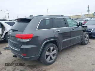 2014 Jeep Grand Cherokee Overland with VIN 1C4RJECG5EC207211, listed as a IAAI auction lot 41586309 with 115,293 mi miles. Bid and sale history available at carsss.com. Image 4.
