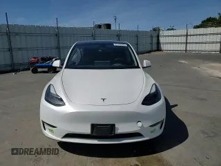 2023 Tesla Model Y Long Range z VIN 7SAYGDEE8PF816544, wystawiony jako Copart lot #57170485 z przebiegiem 74 598 mil mil oraz Szkoda całkowita • Salvage title. Historia ofert i sprzedaży dostępna na DreamBid. Obrazek 13.