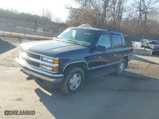1998 Chevrolet Tahoe with VIN 1GNEK13R4WJ371916, listed as a IAAI auction lot 41689311 with 120,749 mi miles. Bid and sale history available at carsss.com. Image 2.