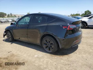 2024 Tesla Model Y Long Range with VIN 7SAYGAEE9RF125458, listed as a Copart auction lot 59567365 with 28,966 mi miles and Salvage title. Bid and sale history available at DreamBid. Image 2.