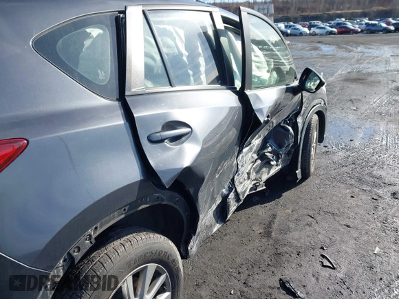 2015 Mazda CX-5 Sport with VIN JM3KE4BY1F0543507, listed as a IAAI auction lot 41530491 with 127,995 mi miles. Bid and sale history available at carsss.com. Image 6.