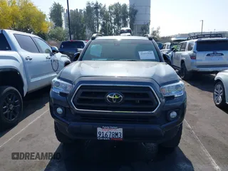 2022 Toyota Tacoma SR5 z VIN 3TMBZ5DN5NM036322, wystawiony jako IAAI lot #42437939 z przebiegiem 77 805 mil mil oraz . Historia ofert i sprzedaży dostępna na DreamBid. Obrazek 13.