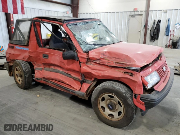 1994 Geo Tracker z VIN 2CNBE18U3R6952403, wystawiony jako Copart lot #79038524 z przebiegiem 271 461 mil mil oraz Szkody całkowita. Historia ofert i sprzedaży dostępna na DreamBid. Obrazek 4.