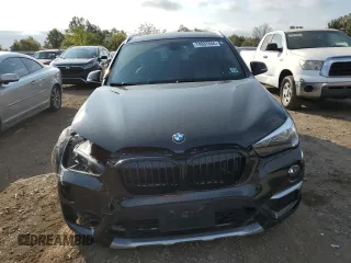 2018 BMW X1 xDrive28i with VIN WBXHT3C33J5F90612, listed as a Copart auction lot 74937654 with 72,561 mi miles and Salvage Title. Bid and sale history available at carsss.com. Image 5.