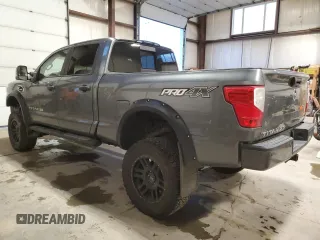 2016 Nissan Titan XD Platinum Reserve with VIN 1N6BA1F44GN503112, listed as a Copart auction lot 81138394 with 143,321 mi miles and Salvage Title. Bid and sale history available at carsss.com. Image 2.