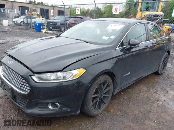 2014 Ford Fusion SE Hybrid with VIN 3FA6P0LU9ER310990, listed as a IAAI auction lot 42336303 with 197,588 mi miles and . Bid and sale history available at DreamBid. Image 2.